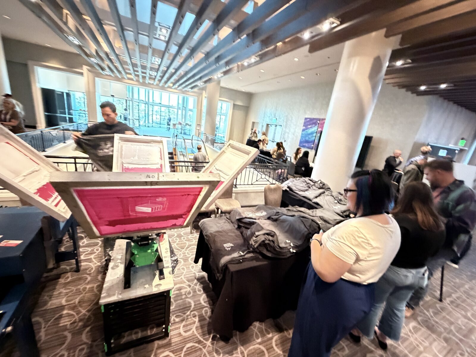 Merch Troop live printing — fresh prints off the platen